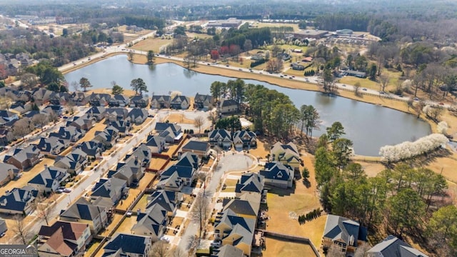 bird's eye view featuring a water view and a residential view