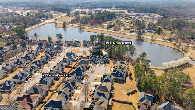 drone / aerial view with a water view and a residential view