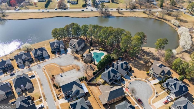 aerial view featuring a residential view and a water view