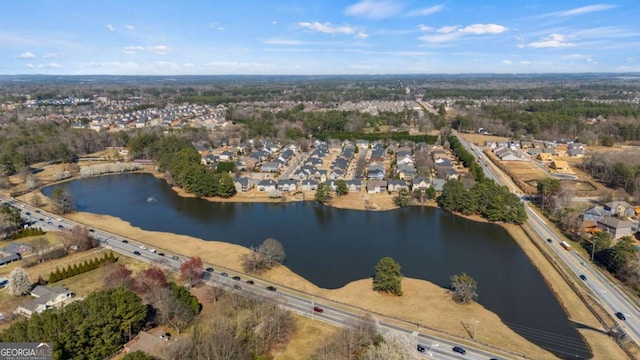 drone / aerial view with a water view