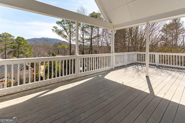 wooden terrace with a mountain view