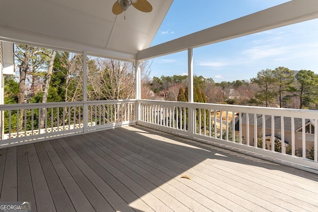 wooden terrace featuring a ceiling fan