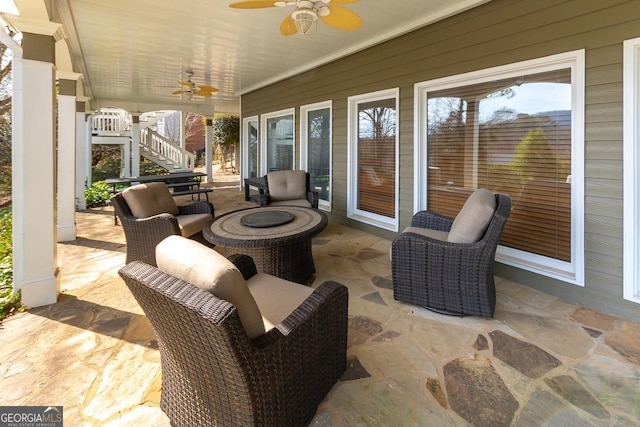 view of patio / terrace featuring stairway and a ceiling fan