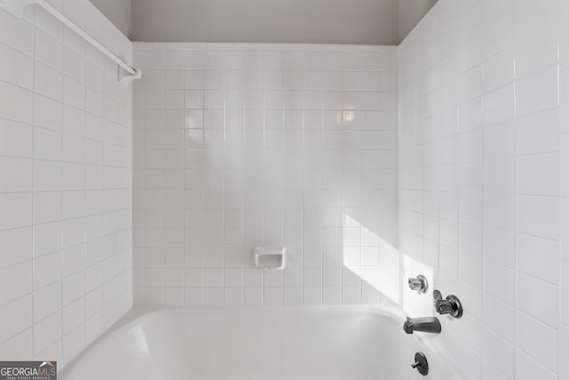 empty room with a tray ceiling, crown molding, baseboards, and a wealth of natural light