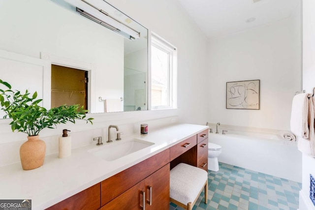 full bath with a garden tub, vanity, and toilet