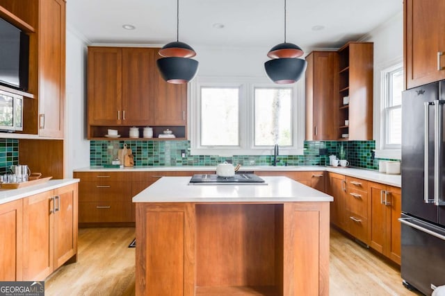 kitchen featuring open shelves, high end fridge, light countertops, and stainless steel gas cooktop