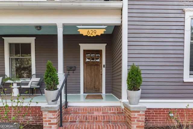 property entrance featuring covered porch