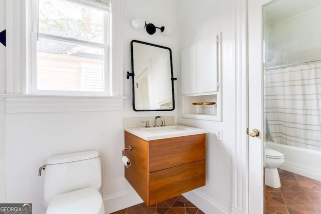 full bath featuring tile patterned floors, toilet, vanity, and baseboards