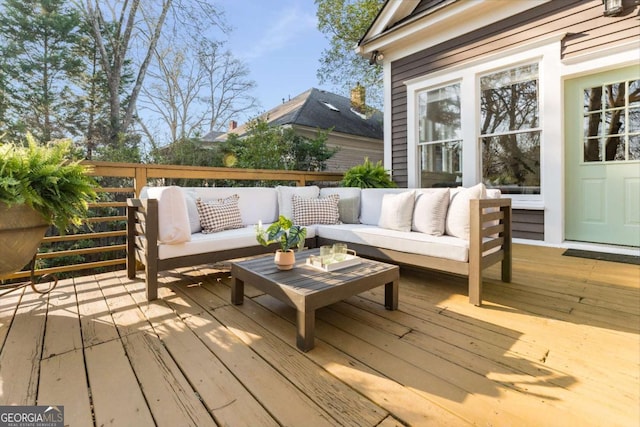 wooden terrace featuring outdoor lounge area