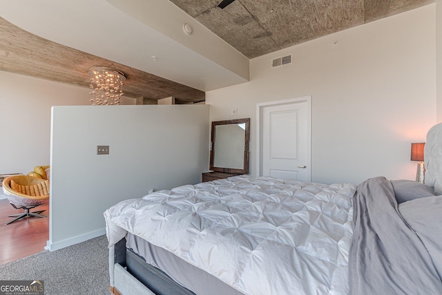 bedroom featuring visible vents, carpet flooring, and baseboards