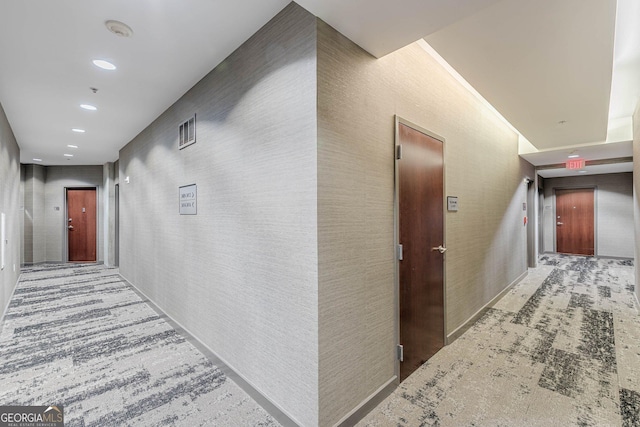 hall featuring elevator and recessed lighting