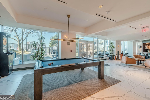 game room with a wealth of natural light, visible vents, marble finish floor, and billiards