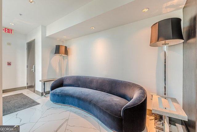 living area with recessed lighting, baseboards, and marble finish floor