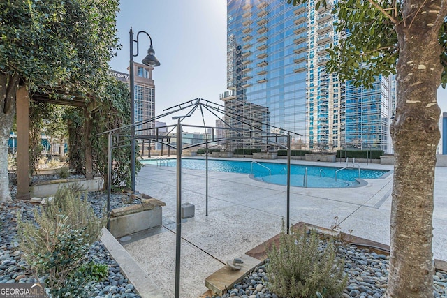 pool with a patio area