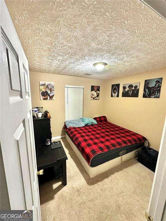 3672 Misty Oak Dr, Flowery Branch, GA 30542 - bedroom featuring carpet flooring
