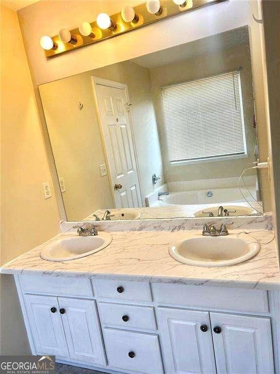 3672 Misty Oak Dr, Flowery Branch, GA 30542 - full bath with a bath and double vanity