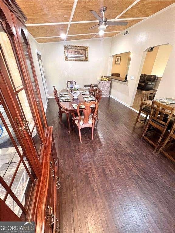 3672 Misty Oak Dr, Flowery Branch, GA 30542 - dining room featuring ceiling fan, wood finished floors, and arched walkways