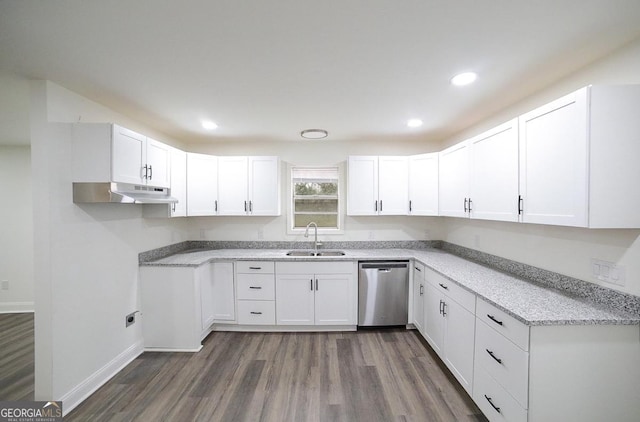 kitchen featuring dishwasher, white cabinets, under cabinet range hood, and a sink