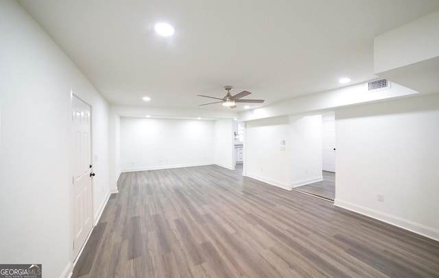 basement with visible vents, a ceiling fan, dark wood-style floors, recessed lighting, and baseboards