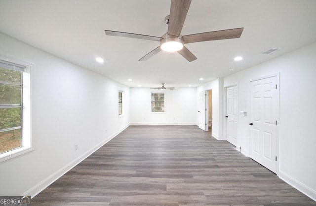 spare room with visible vents, recessed lighting, baseboards, and wood finished floors