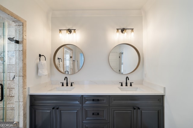 full bath with a shower stall, crown molding, and a sink