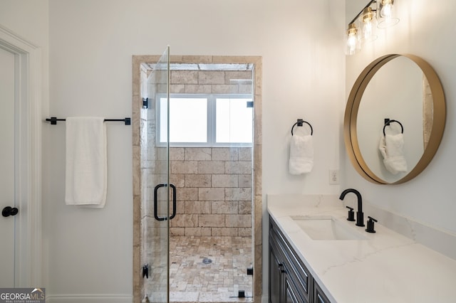 full bath featuring a stall shower and vanity