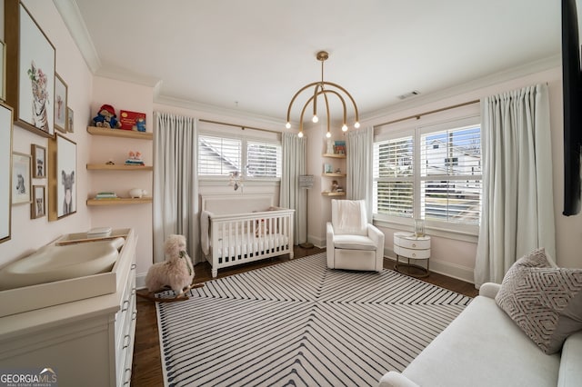 bedroom featuring crown molding, dark wood-style floors, visible vents, and baseboards