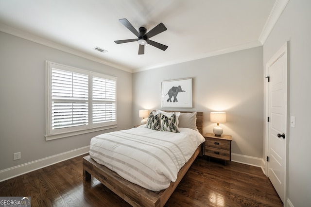 bedroom featuring visible vents, baseboards, dark wood-style floors, and ornamental molding