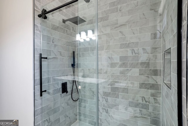 bathroom with a tile shower