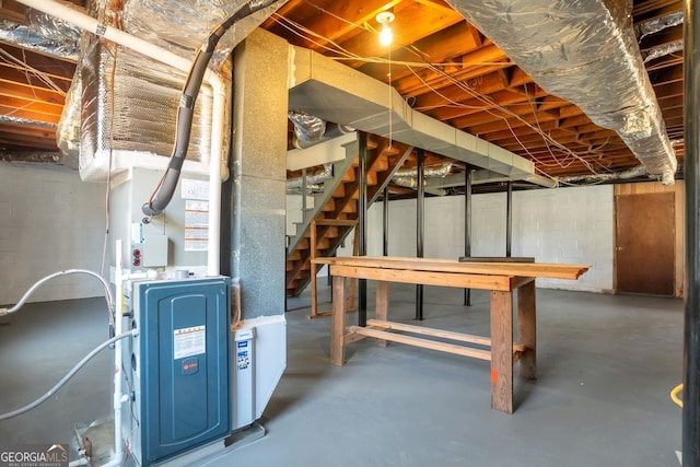 unfinished basement featuring stairs