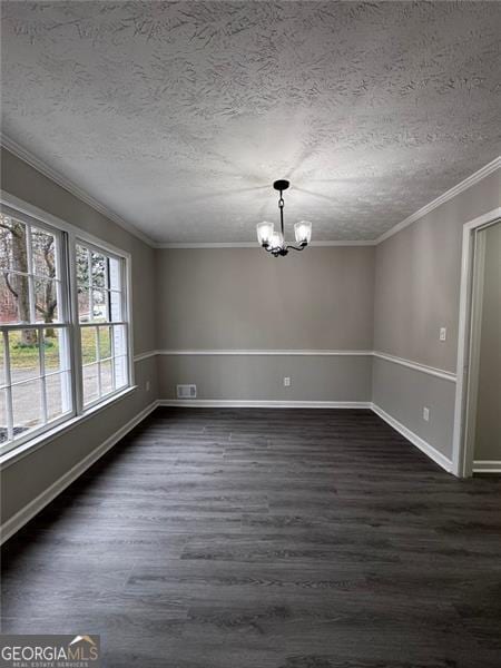 unfurnished dining area featuring dark wood finished floors, crown molding, a notable chandelier, and a textured ceiling