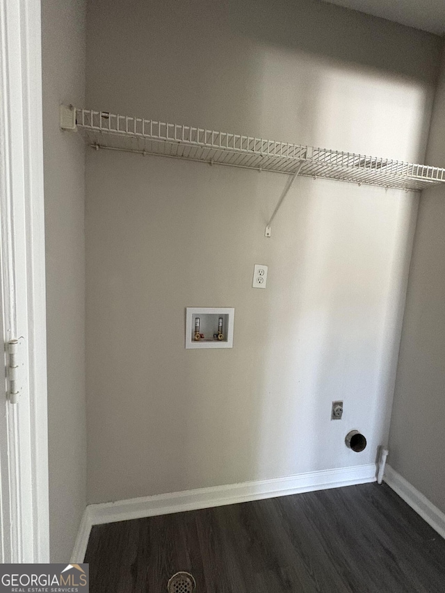 washroom featuring electric dryer hookup, baseboards, dark wood-type flooring, and hookup for a washing machine