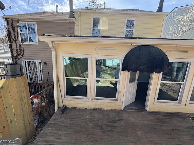 exterior space featuring a deck and fence