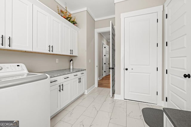 laundry area with marble finish floor, washer / clothes dryer, cabinet space, crown molding, and baseboards