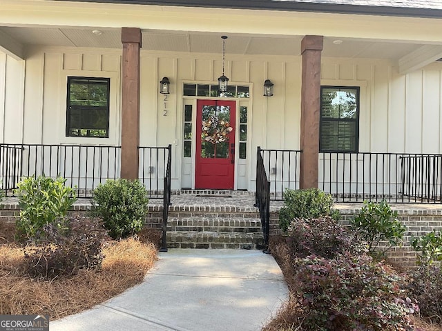 212 Cardiff Ct, Ball Ground, GA 30107 - entrance to property featuring board and batten siding and a porch