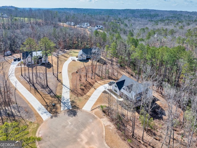 aerial view featuring a forest view