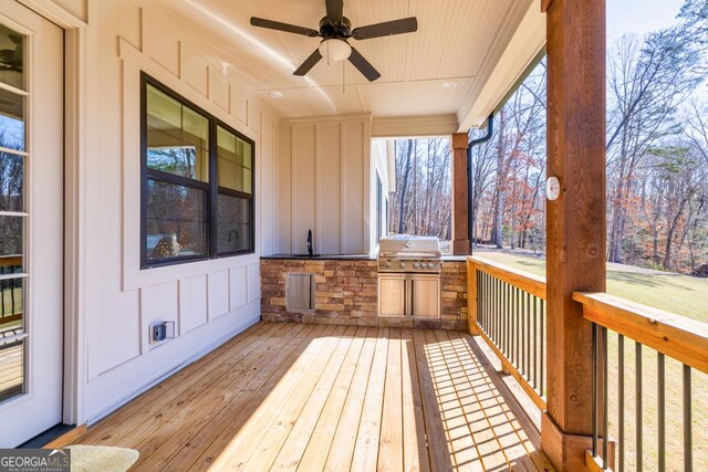 212 Cardiff Ct, Ball Ground, GA 30107 - wooden deck with area for grilling, ceiling fan, and a sink