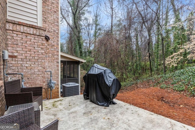 view of patio / terrace featuring central AC and a sunroom