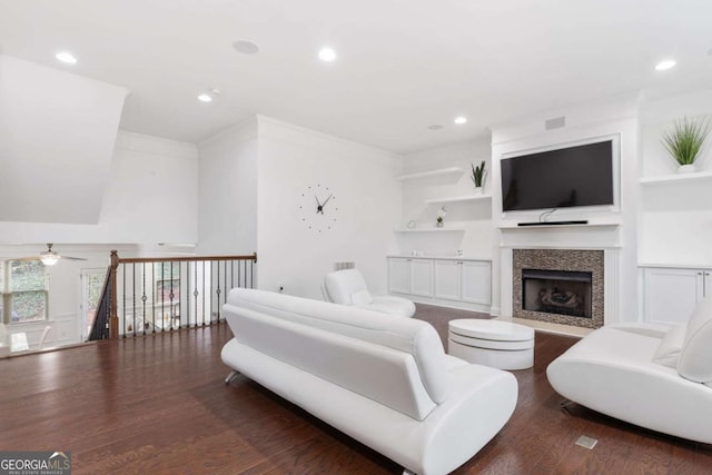 living room featuring built in shelves, wood finished floors, recessed lighting, and ceiling fan