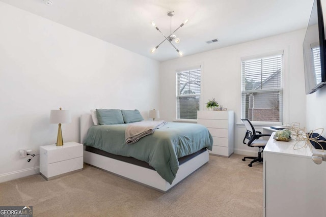 bedroom with visible vents, baseboards, light colored carpet, and an inviting chandelier