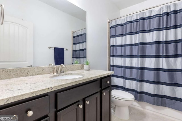 full bathroom featuring tile patterned floors, toilet, a shower with shower curtain, and vanity