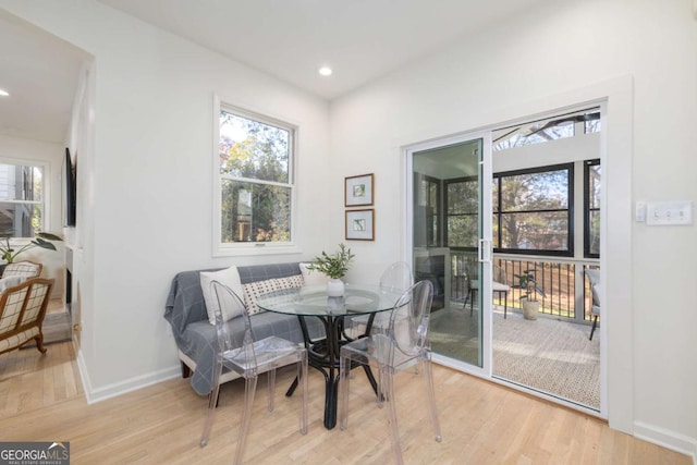 dining area with plenty of natural light, recessed lighting, baseboards, and wood finished floors