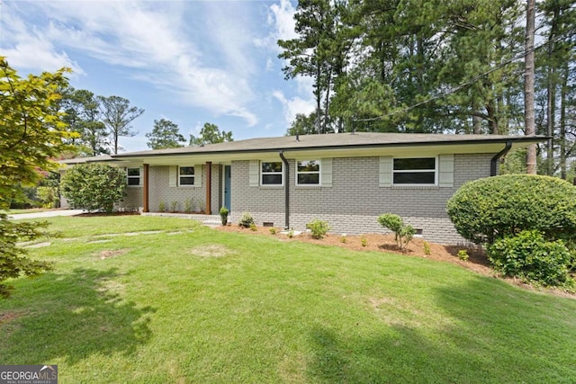 ranch-style home featuring crawl space, brick siding, and a front yard