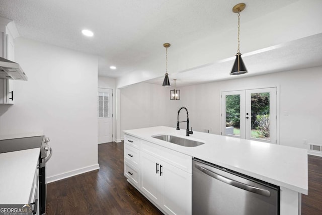 kitchen featuring light countertops, stainless steel appliances, dark wood-style floors, white cabinetry, and a sink