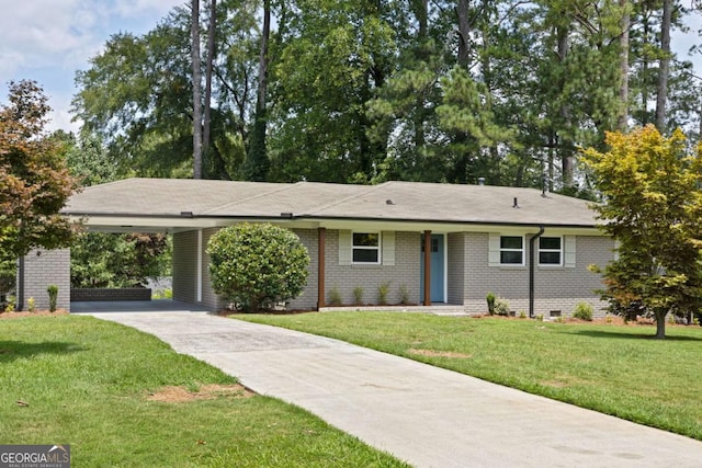 ranch-style home with brick siding, crawl space, a carport, and driveway