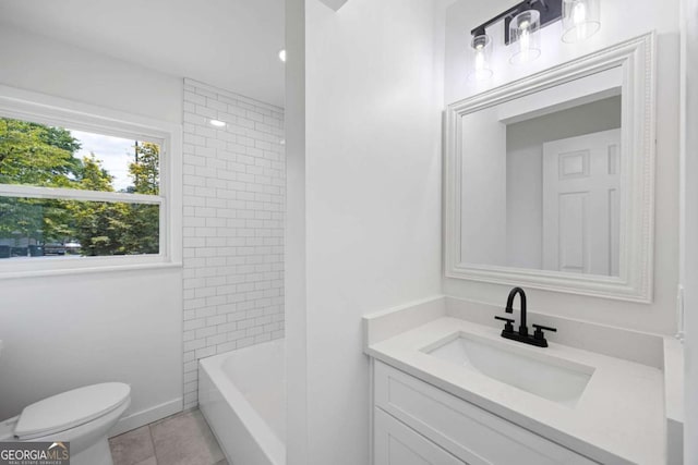 full bathroom featuring vanity, tile patterned floors, toilet, and shower / bathing tub combination