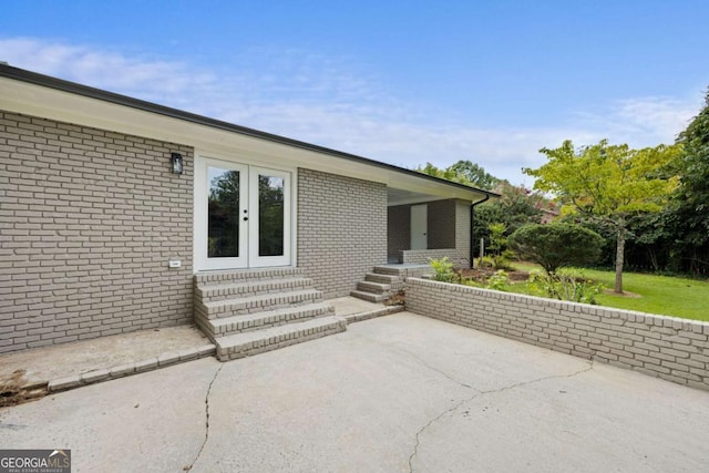 view of patio / terrace featuring entry steps and french doors