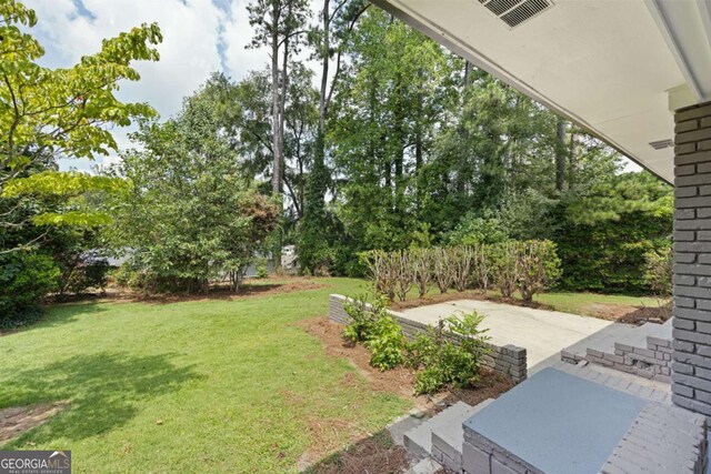 view of yard with a patio area and visible vents