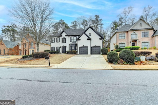 view of front of property featuring a garage and concrete driveway