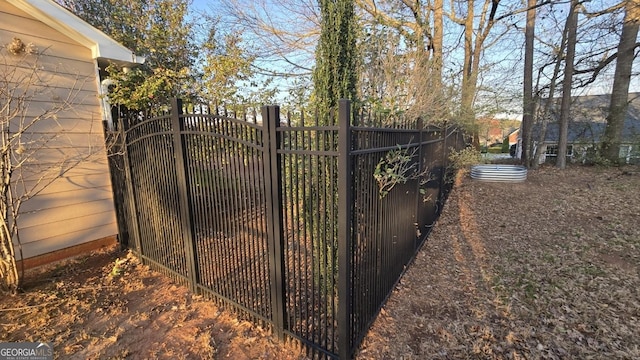 view of gate with fence